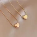 XIYANIKE – collier en acier inoxydable 316L pour femmes pendentif en forme de cœur 2 couleurs ras
