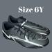 Nike Shoes | *New* Nike Youth Jr. Phantom Gt2 Club Soccer Cleats Size 6y Black/Metallic Grey | Color: Black/Gray | Size: 6y