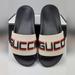 Gucci Shoes | Gucci Kid's Off-White/Black Rubber Logo Pool Slides. Wow | Color: Black/White | Size: Kid's 30