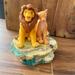 Disney Accents | Disney Lion King 1994 Music Box Can You Feel The Love Tonight. Simba And Nala | Color: Tan | Size: See Description