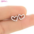 Mini boucles d'oreilles simples en forme de cœur creux couleur argent bijoux d'oreille pour