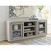 Signature Design by Ashley 2 - Door Mirrored Accent Cabinet Wood in Brown/Gray | 28.38 H x 67 W x 16.13 D in | Wayfair A4000430