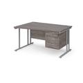 Maestro 25 left hand wave desk 1400mm wide with 3 drawer pedestal - silver cantilever leg frame, grey oak top