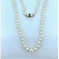 Very Good Vintage Row Of Cultured Pearls. Excellent Lustre. 24 Inches. Graduated. Knotted. 9Ct Gold Garnet Clasp. Pearl Necklace