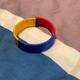 Urban Outfitters Jewelry | 4/$20 Urban Outfitters Cloth Colombia Bracelet Red Yellow Blue | Color: Red/Yellow | Size: Os