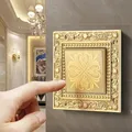 Luxurious metal hand-polished button switch pattern engraving control panel on the wall lighted