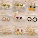 Clips d'oreille fleur de camélia pour femme clip acrylique boucles d'oreilles en perles de qualité