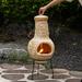 Outdoor Clay Chiminea Fireplace Sun Design Wood Burning Fire Pit with Sturdy Metal Stand, Barbecue, Cocktail Party