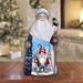 The Holiday Aisle® Flower Gnome Santa Wood Carved Masterpiece Figurine By G. Debrekht Wood in Blue/Brown | 7.5 H x 4 W x 4 D in | Wayfair
