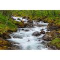 Norway-Nordland-Tysfjord. Woman sitting along Storelva-river that flows from Stetind mountain Poster Print - Fredrik Norrsell (36 x 24)