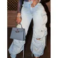Processo lavato alla moda Jeans Cargo consumati da donna con tasche pantaloni in Denim Casual