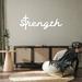 Trinx Strength Cross Script Metal Wall Décor Metal in White | 11 H x 32 W x 1 D in | Wayfair E638D10340EA4271A423464AE0A35DA4