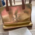 Tory Burch Bags | Gold Tory Burch Purse Tote Handbag Embedded Logo | Color: Gold | Size: Os