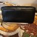 Coach Bags | Coach Black Leather Zip Around Wallet With Black Leather Interior. Guc | Color: Black | Size: 8” X 4 1/2” X 1”