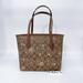 Coach Bags | Coach Cn682 Mini City Tote In Signature Canvas With Star And Snowflake Print Nwt | Color: Brown/Gold | Size: Mini