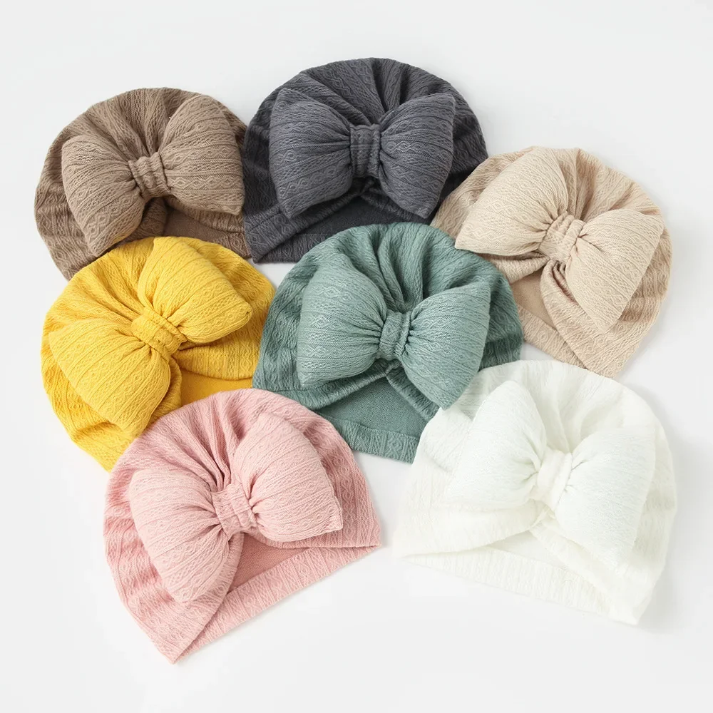 Gestrickte Bowknot Baby mütze niedliche Baby Mädchen Jungen Hut Bogen Turban weiche Neugeborene Mütze Strick mützen Babys Zubehör Image