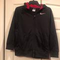 Nike Jackets & Coats | Nike -Boys Large Zip Front Jacket. Classic Outer Shell, Soft Fleecy Feel Inside | Color: Black/Red | Size: Lb