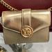 Michael Kors Bags | Michael Kors Carmen Medium Logo And Faux Leather Wallet Pale Gold Nwt | Color: Gold | Size: Medium