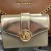 Michael Kors Bags | Michael Kors Carmen Medium Logo And Faux Leather Wallet Pale Gold Nwt | Color: Gold | Size: Medium