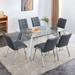 Table and chair set, 1 table and 6 black chairs. Rectangular glass dining table with metal legs armless PU dining chairs