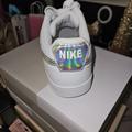 Nike Shoes | Host Pick Euc Nike Airforce One Color: White & Silver Holograph Size: 9.5 | Color: Silver/White | Size: White With Holograph Silver Nike Symbol