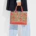 Coach Bags | Coach Dempsey Carryall In Signature Canvas & Leather With Wild Strawberry Print | Color: Red/Tan | Size: Measures: 11 1/2" (L) X 8 3/4" (H) X 5" (W)
