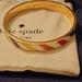 Kate Spade Jewelry | Kate Spade Flying Colors Idiom Bangle Bracelet Gold-Tone & Enamel | Color: Red/Yellow | Size: Os