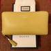 Gucci Bags | Gucci Neon Yellow Pebbled Leather Zippy Wallet W/Bamboo Pull/Dust Bag/Gift Box | Color: Yellow | Size: 7.25" (W) X 3.75" (H) X 1" (D)