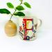 Anthropologie Dining | Anthropologie Petal Palette Monogram "F" Mug Designer Starla M. Halfmann | Color: Cream/Red | Size: Os