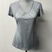 Athleta Tops | Athleta Brand Gray Short Sleeve Workout Top With Some Open Lace-Mesh Detailing. | Color: Gray | Size: S