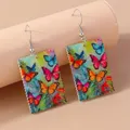 Boucles d'oreilles pendantes papillon colorées pour femmes crochets animaux en résine bijoux de