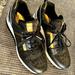 Michael Kors Shoes | Nwot Michael Kors 9.5m Sneakers Never Worn | Color: Black/Gold | Size: 9.5