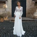 Robe de mariée bohème élégante à manches longues pour mariée dentelle transparente col en V ligne