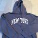 Brandy Melville Tops | John Galt Brandy Melville Blue New York Hoodie | Color: Blue/White | Size: One Size