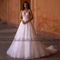 Robe de mariée scintillante à col en V appliques de fibres ligne A dos nu robe de patients de