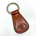 Dooney & Bourke Accessories | Dooney & Bourke Caramel Cognac Brown Leather Donegal Crest Keyring Key Fob Chain | Color: Brown/Tan | Size: Os