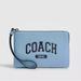 Coach Bags | Coach Corner Zip Pebbled Leather Wristlet With Varsity Print In Cornflower Blue | Color: Blue | Size: Measures: 6 1/4" (L) X 4" (H) X 1/2" (W)