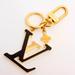 Louis Vuitton Accessories | Louis Vuitton Metal Taurillon Lv Capucines Bag Charm Key Holder Black M63080 | Color: Black/Gold | Size: Os
