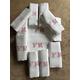 A set of 12 antique French Damask linen serviettes/ napkins with a red embroidered monogram FM on a white background circa 1890