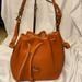 Dooney & Bourke Bags | Dooney & Bourke Vintage Drawstring Bucket Bag Camel Color | Color: Brown/Tan | Size: Os