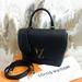 Louis Vuitton Bags | Louis Vuitton Black Pebbled Leather Taurillon Volta Shoulder Bag | Color: Black/Gold | Size: Os