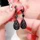 Boucles d'oreilles pendantes en forme de goutte de cristal noir pour femmes bijoux élégants