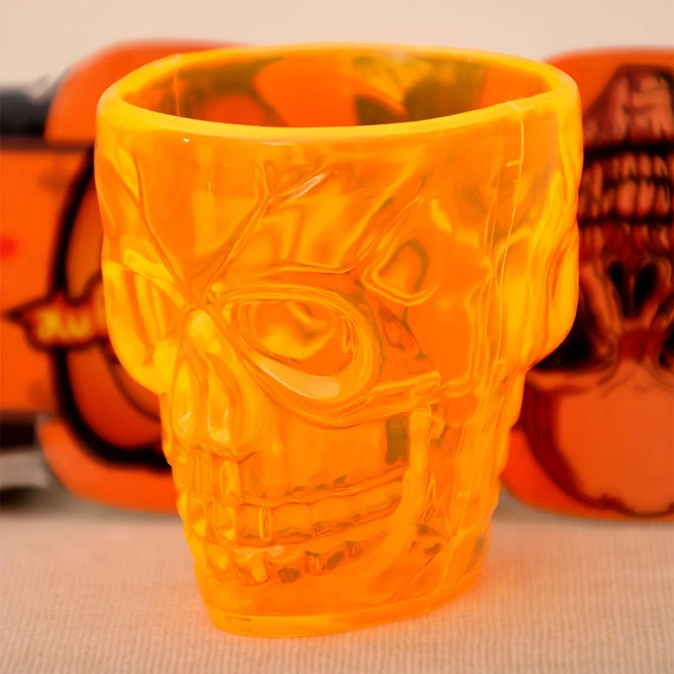 1pc kreative transparente orange Schädel Druck becher, Plastik funky Wasser becher für den Haushalt Image