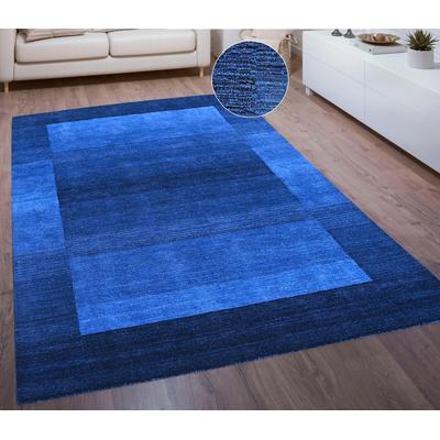 Wollteppich THEKO "Gabbeh Super, Handweb Teppich, Bordüre, reine Wolle, handgewebt" Gr. 8, blau (dunkelblau), B:300cm H:9mm L:400cm, Wolle, Teppiche, Schlafzimmer, Wohnzimmer, Esszimmer, auch als Läufer und Bettumrandung Image