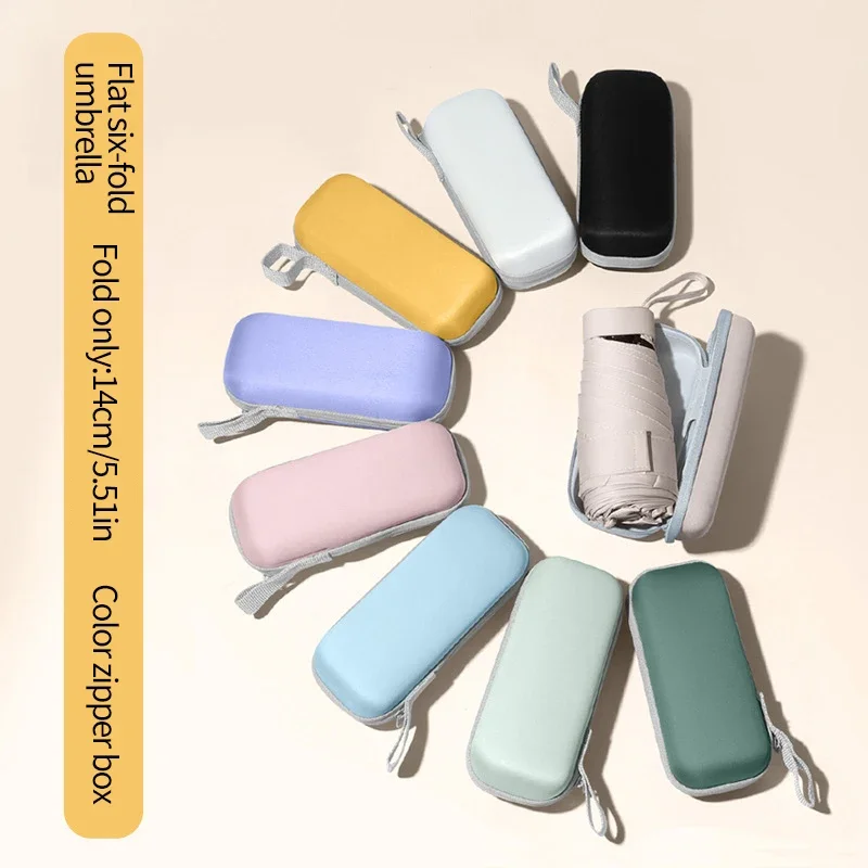 Ein einfarbiger Regenschirm mit Kapselbox und faltbarem Regenschirm für einfaches Reisen. Der Regenschirm ist sowohl sonnig als auch r geeignet Image