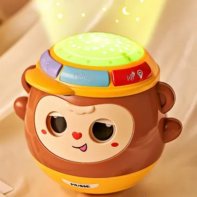 1pc Monkey Hand Drum Toy That Can Blink, Early Education Multifunctional Rhythm Projection Hand Drum