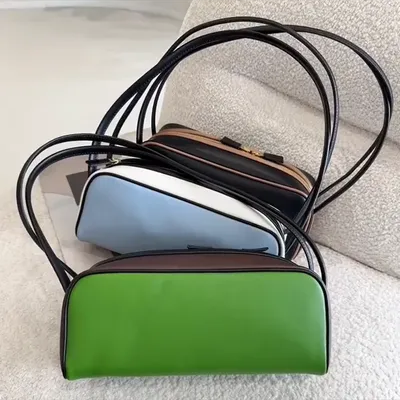 2025 Brand Genuine Leather Portable Bowling Bag Women's Super Fire Color Splicing Advanced Sense Shoulder Commuter Underarm Bag