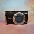 Canon Powershot SX200 nera è una fotocamera digitale Y2K con scheda SD, lettore di schede SD USB C, caricabatterie