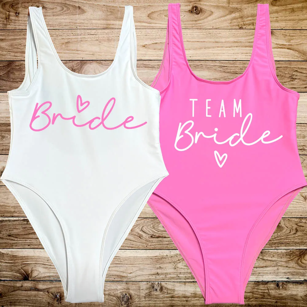 Pink TEAM Bride Heart Print One Piece Swimsuit Women Swimwear High Cut Low Back Sexy Bodysuit Bachelorette Party Bathing Suit Image
