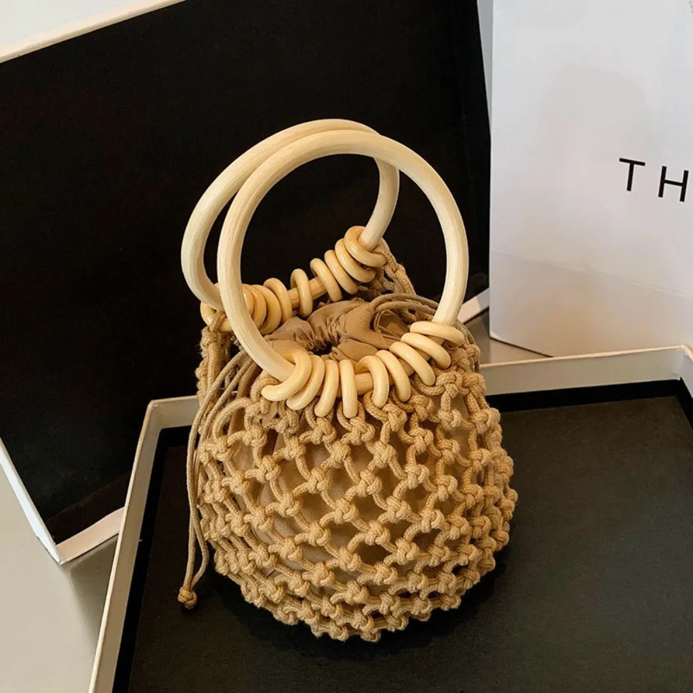 Borsa a mano intrecciata in paglia intrecciata portatile Elegante borsa a secchiello fatta a mano Borsa da spiaggia intrecciata con design di nicchia in stile coreano per le vacanze